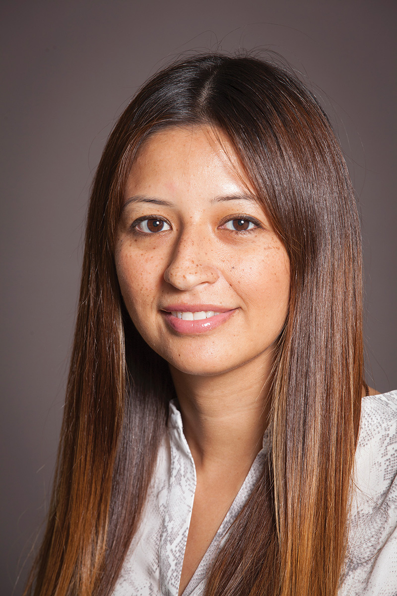 Roxana Chicas wears a white top in a portrait