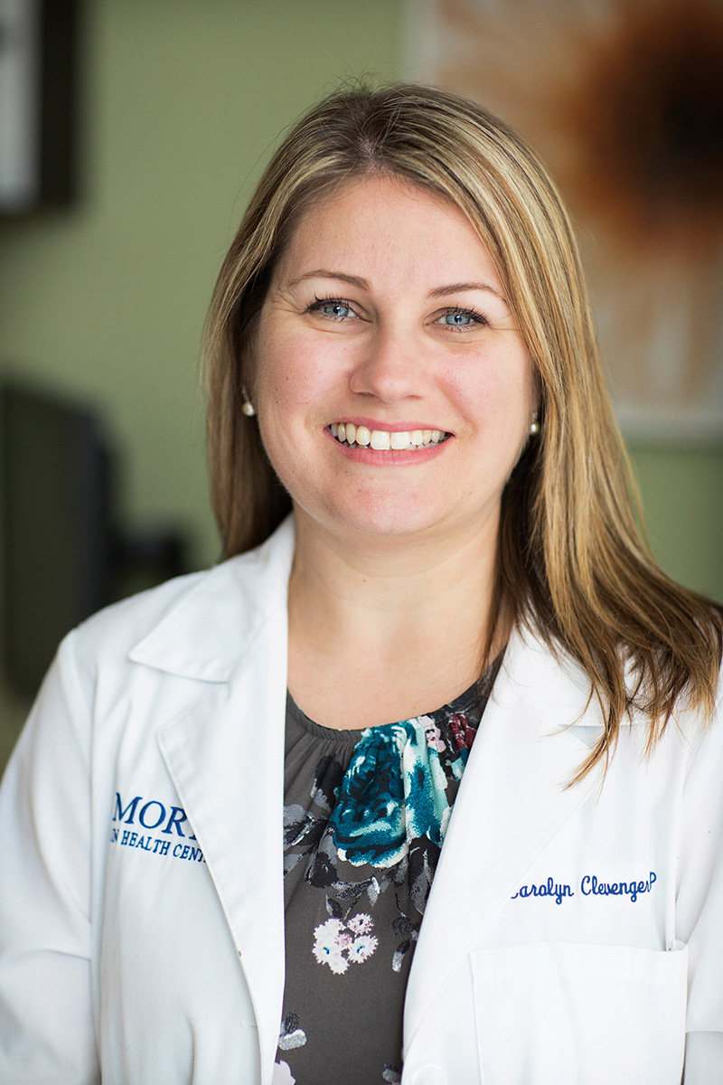 Carolyn Clevenger smiles in an Emory lab coat.