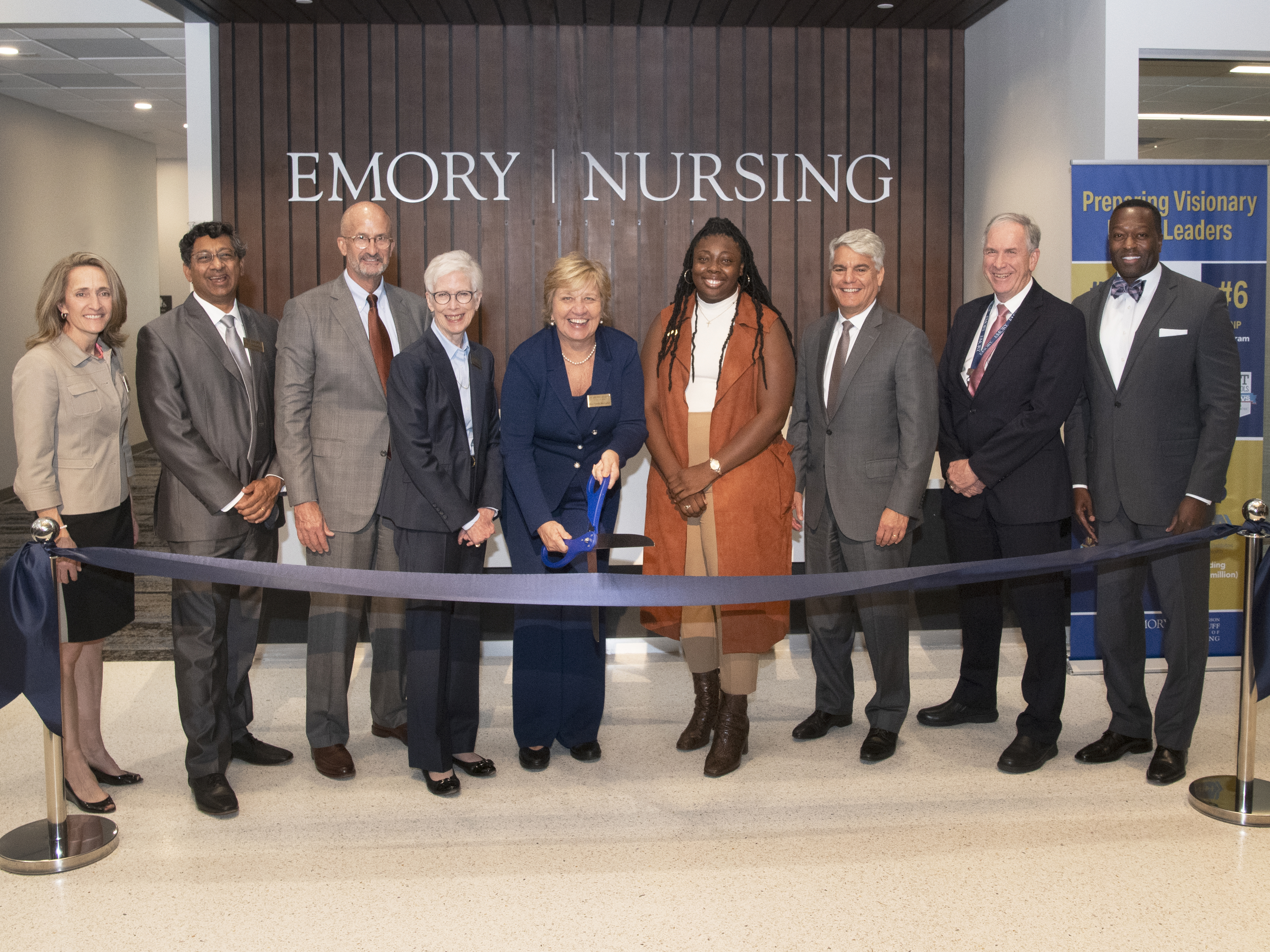 Emory and Decatur officials prepare to cut the ribbon to open the Emory Nursing Learning Center