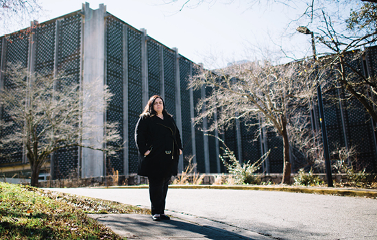 Kylie Smith stands in the hallway of the building that housed the Georgia Mental Health Institute near Emory.